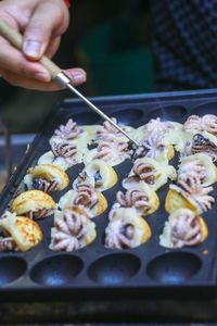 Takoyaki being prepared in ho thi ky street food, ho chi minh city