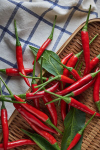 Close-up of red chili peppers in basket