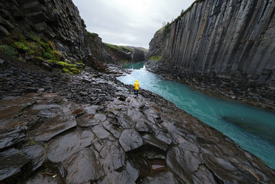 High angle view of people walking on rock