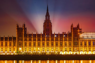 Buildings in city at night