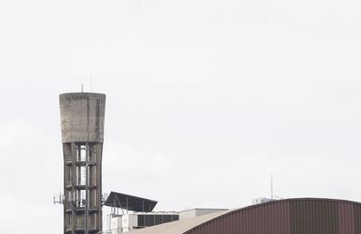 Low angle view of water tower against sky