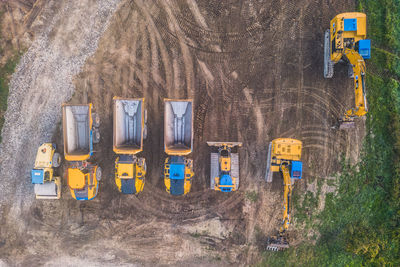 Excavators and dump trucks working during the construction of the viaduct on the drôme river. 