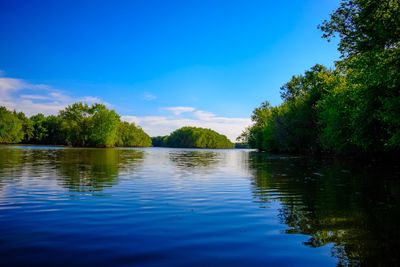 Scenic view of lake against blue sky
