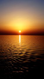 Scenic view of sea against sky at sunset