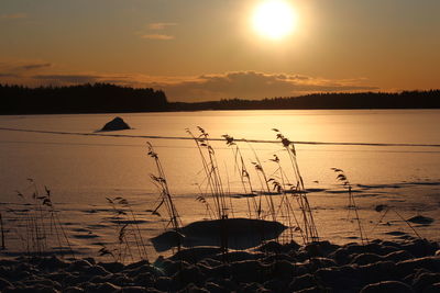 Scenic view of sea against sky during sunset