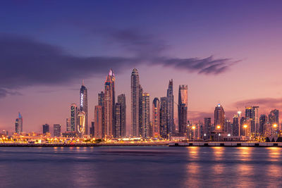 Amazing dubai marina and famous jumeirah beach at sunset, united arab emirates