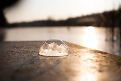 Close-up of water on beach against sky