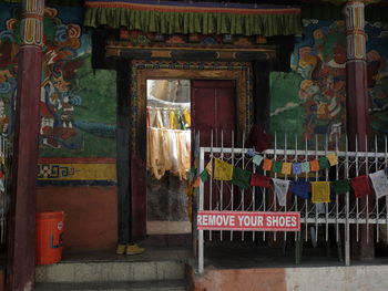 Multi colored lanterns hanging on entrance of building