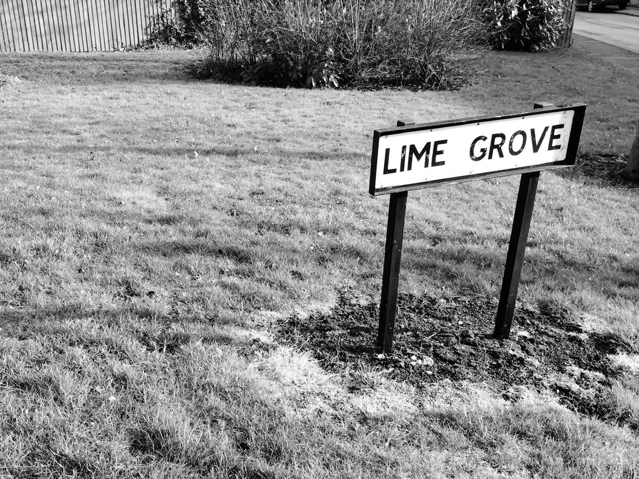 text, communication, western script, grass, information sign, sign, field, guidance, information, capital letter, non-western script, road sign, warning sign, safety, day, growth, grassy, no people, fence, plant