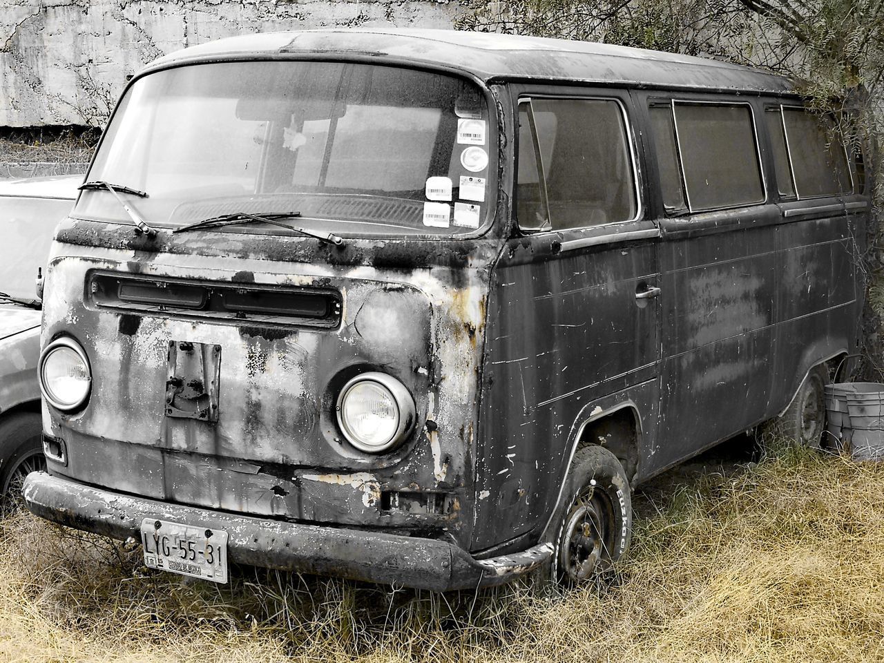 OLD RUSTY CAR ON LAND