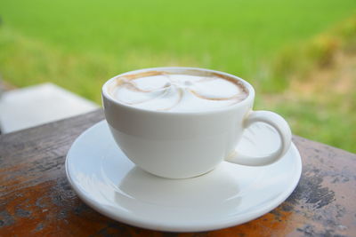 Close-up of cappuccino on table