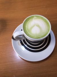 High angle view of coffee cup on table