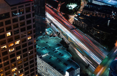 High angle view of city lit up at night