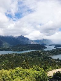 Scenic view of mountains against cloudy sky