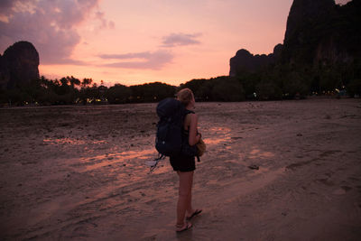 Silhouette of woman standing on beach