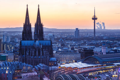 High angle view of city buildings during sunset