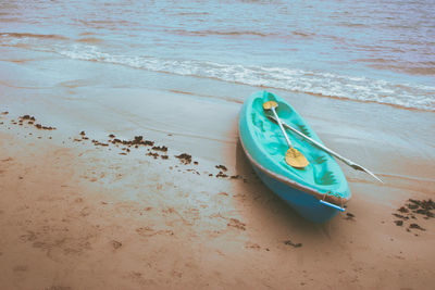 High angle view of abandoned boat moored on beach