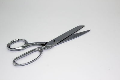 High angle view of eyeglasses on table against white background