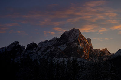 Low angle view of rock formation against sky during sunset