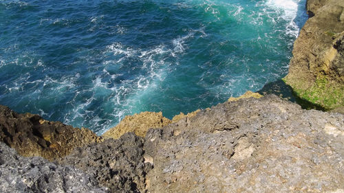 High angle view of rock formation in sea