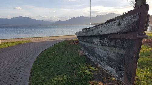 View of narrow curved road along the lake