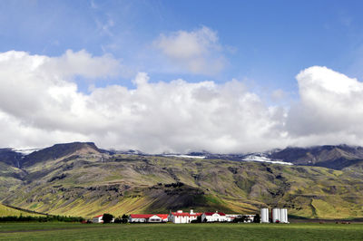 Scenic view of landscape against cloudy sky