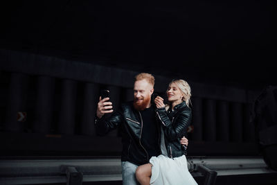 Young couple standing outdoors