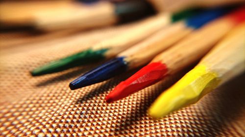 Close-up of colored pencils on table