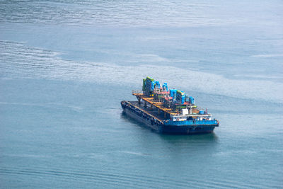 High angle view of ship sailing in sea