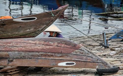 High angle view of abandoned boat moored on shore