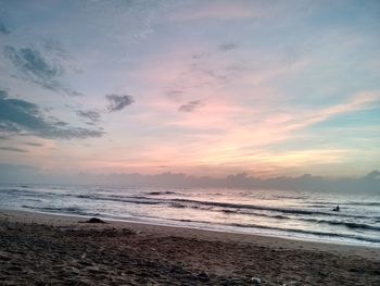 Scenic view of sea against cloudy sky