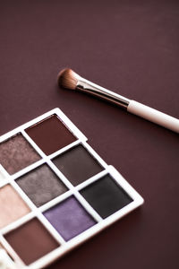 Close-up of make-up brush on table