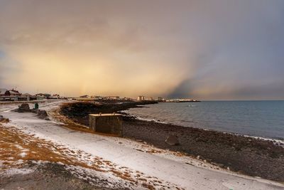 Scenic view of sea against cloudy sky