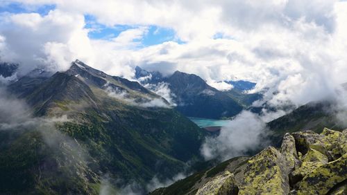 Scenic view of mountains against cloudy sky