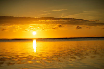 Scenic view of sea against romantic sky at sunset