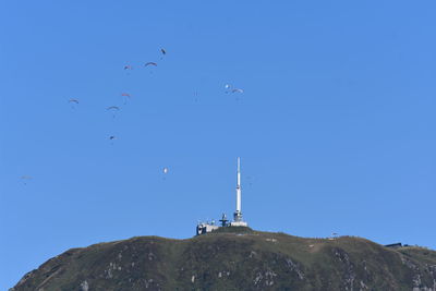 Low angle view of tower against clear blue sky