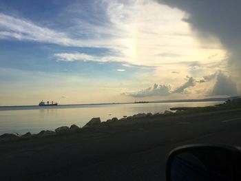 Scenic view of sea against cloudy sky