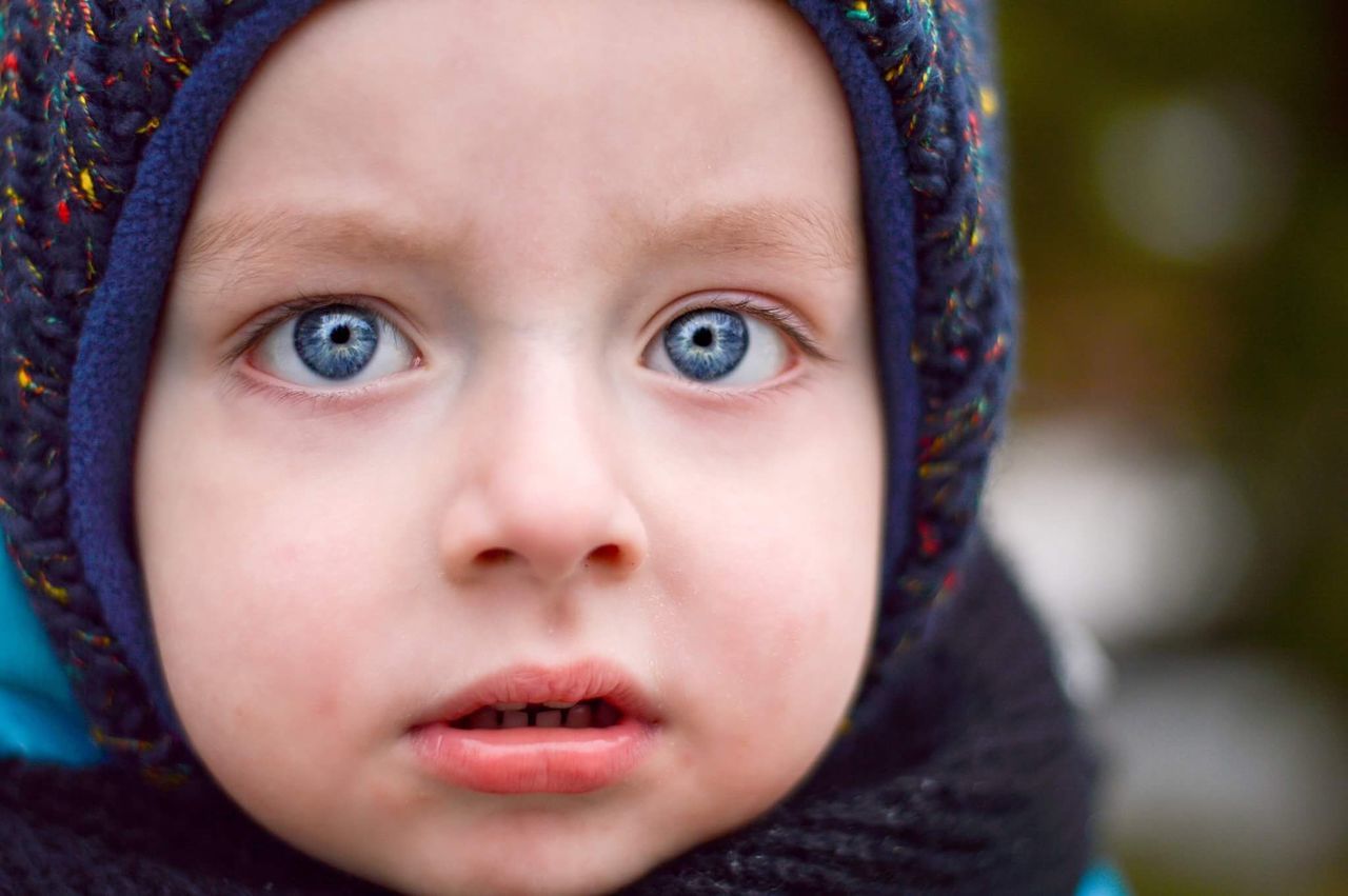 childhood, close-up, human face, one person, focus on foreground, front view, portrait, headshot, looking at camera, real people, day, human eye, outdoors, people