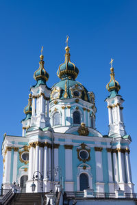 Low angle view of building against blue sky