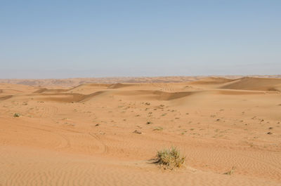 Scenic view of desert against clear sky