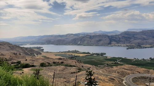 Scenic view of landscape and mountains against sky
