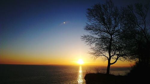 Scenic view of sunset over sea