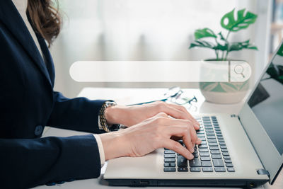 Man using laptop on table