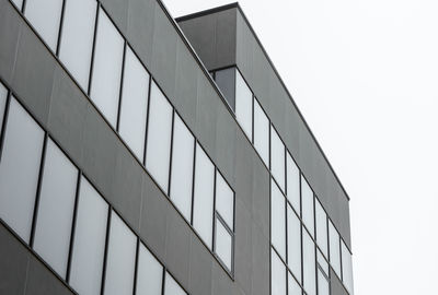 Low angle view of modern building against clear sky