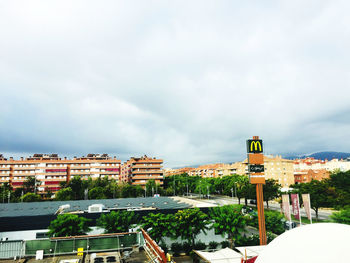 Buildings in city against sky