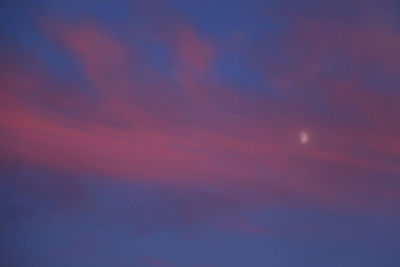 Low angle view of dramatic sky at night