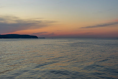 Scenic view of sea against sky at sunset