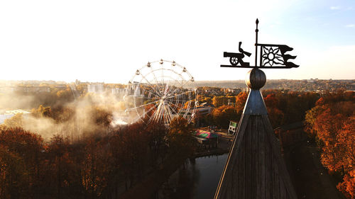 View of amusement park against clear sky