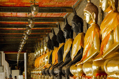 Low angle view of statues in temple outside building