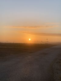 Scenic view of landscape against sky during sunset